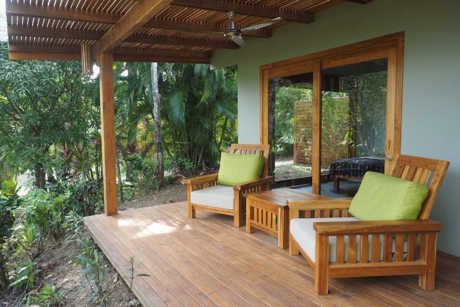 Private covered deck with teak chairs at Garden Heights Studio in Montezuma, Costa Rica