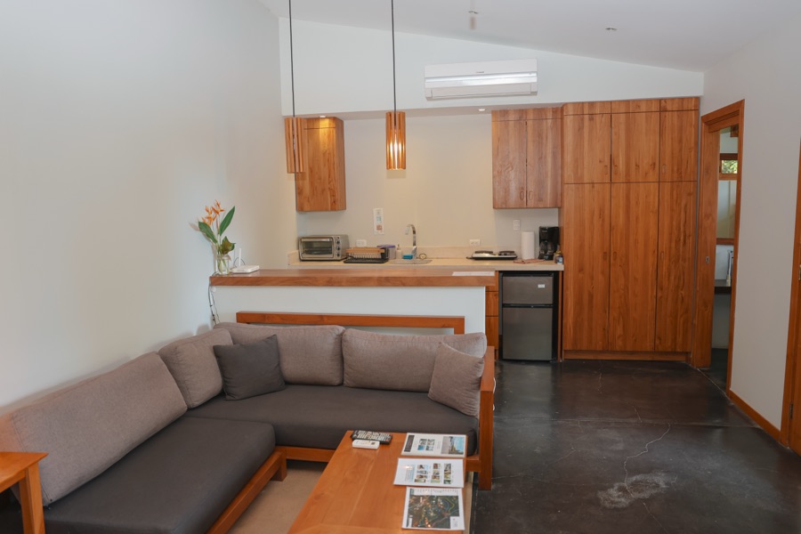 Garden Heights Studio living area with sofa and kitchenette