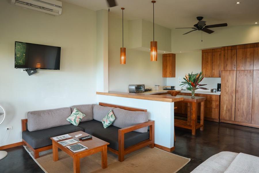 Sunrise Studio living area with sofa and open kitchen